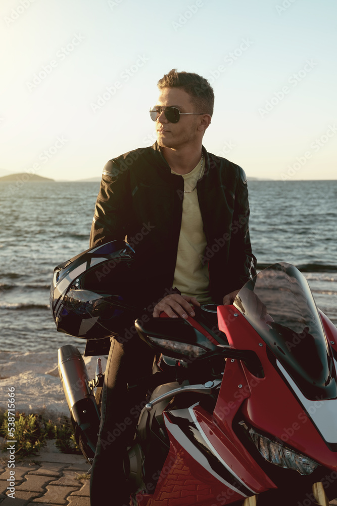 Fototapeta premium Portrait of a motorcycle rider with sunglasses