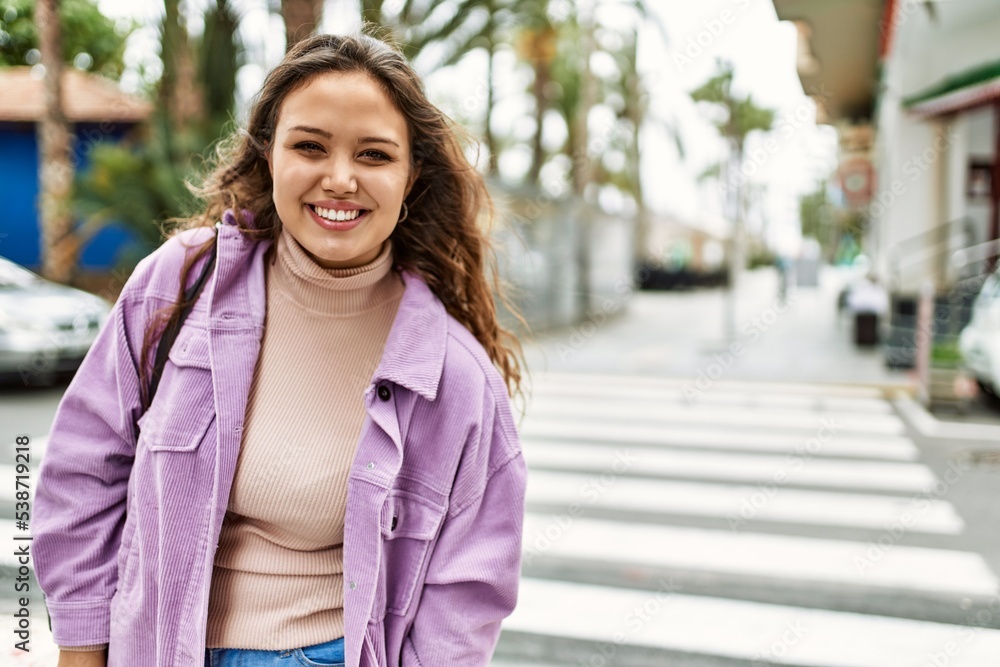 young hispanic girl smiling happy standing at the city. young hispanic girl smiling happy standing at the city.