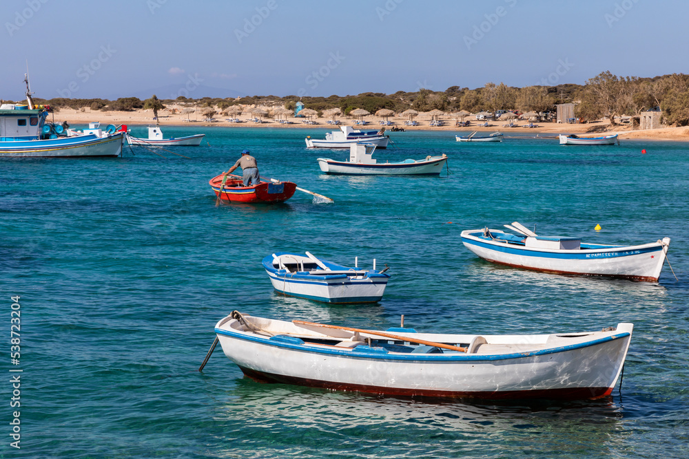 Colorful boats in blue water on Amorgos, Greek Islands