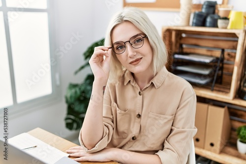Young caucasian woman smiling confident working at office