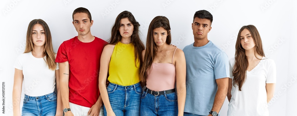 Φωτογραφία Group of people wearing casual clothes standing over isolated background depressed and worry for distress, crying angry and afraid