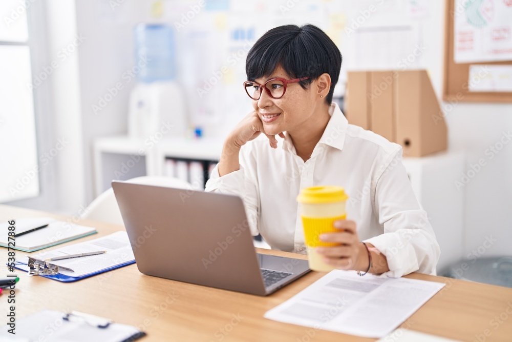 Middle age chinese woman business worker using laptop working at office Middle age chinese woman business worker using laptop working at office