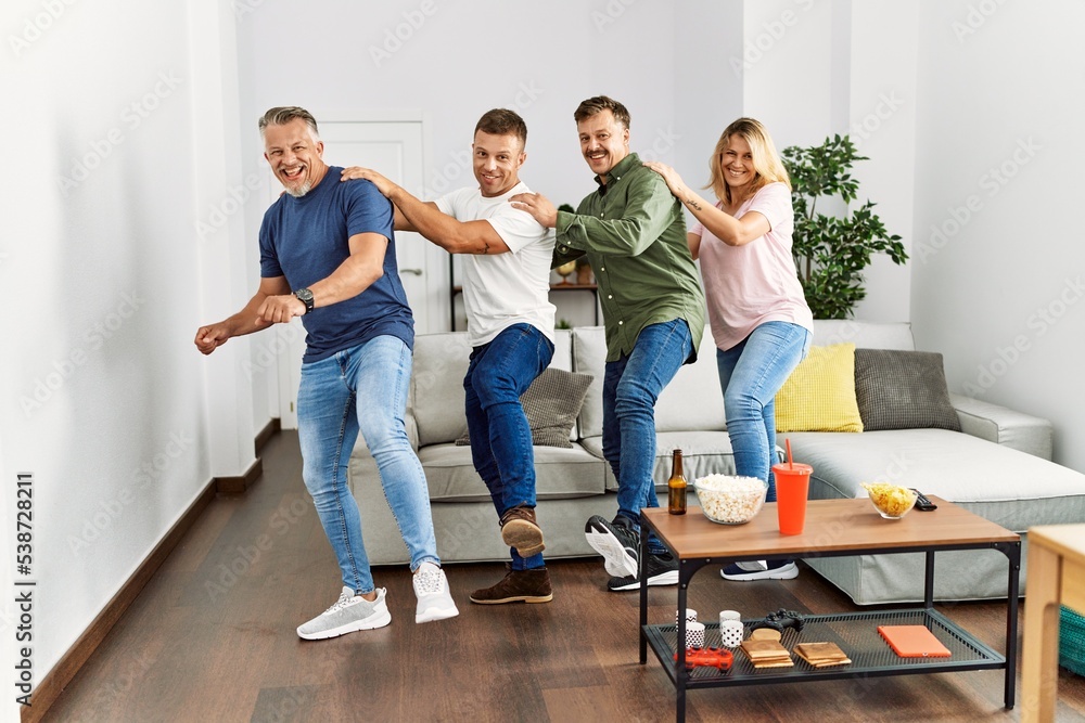 group of middle age friends on party dancing at home. group of middle age friends on party dancing at home.