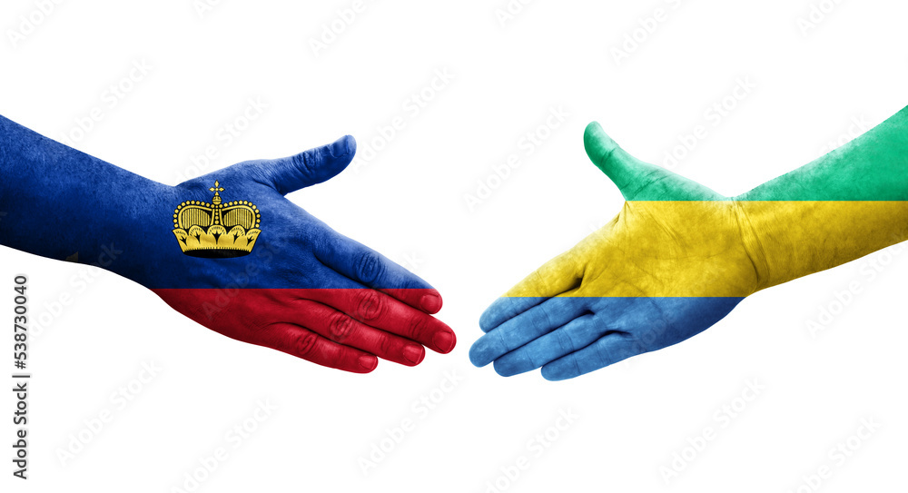 Handshake between Gabon and Liechtenstein flags painted on hands, isolated transparent image. Handshake between Gabon and Liechtenstein flags painted on hands, isolated transparent image.