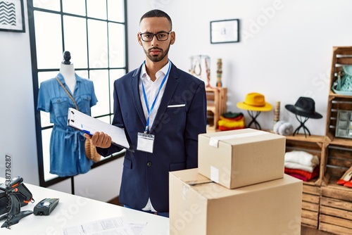 African american man working as manager at retail boutique skeptic and nervous, frowning upset because of problem. negative person. © Krakenimages.com