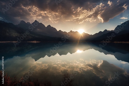The sun breaks through the clouds over a mountain lake. Sun breaking through clouds over mountain lake landscape. Mountain lake landscape. Lake in mountains © 2rogan