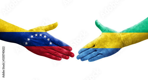 Handshake between Gabon and Venezuela flags painted on hands, isolated transparent image.