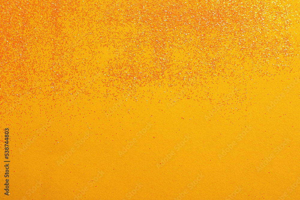 Shiny bright glitter on yellow background, flat lay. Space for text Shiny bright glitter on yellow background, flat lay. Space for text