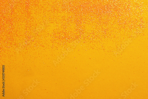 Shiny bright glitter on yellow background, flat lay. Space for text