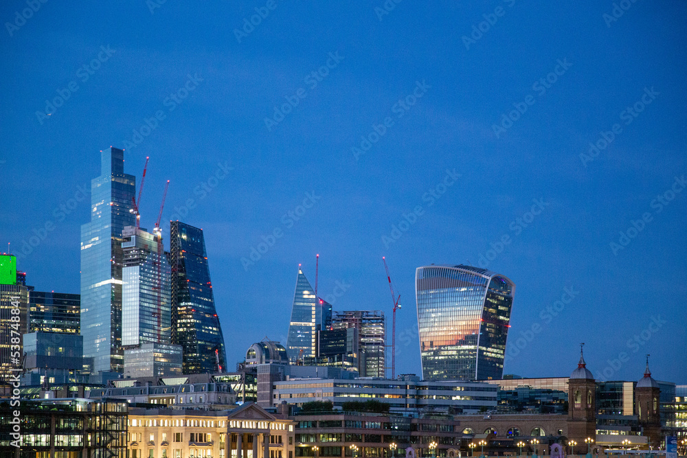 Naklejka premium Londons skyline at sunset including the Walkie-Talkie