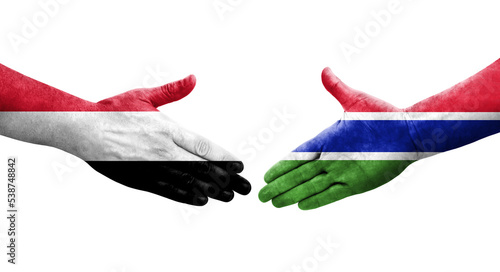Handshake between Gambia and Yemen flags painted on hands, isolated transparent image.