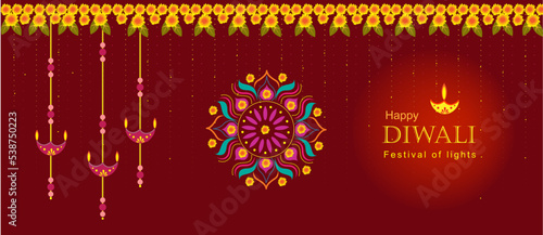 Happy Diwali banner with rangoli and lamps. Decoration with auspicious marigold garland for Diwali.