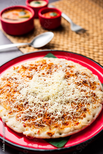 Cheese uttapam pizza, south Indian food with a twist. served with sambar and chutney photo