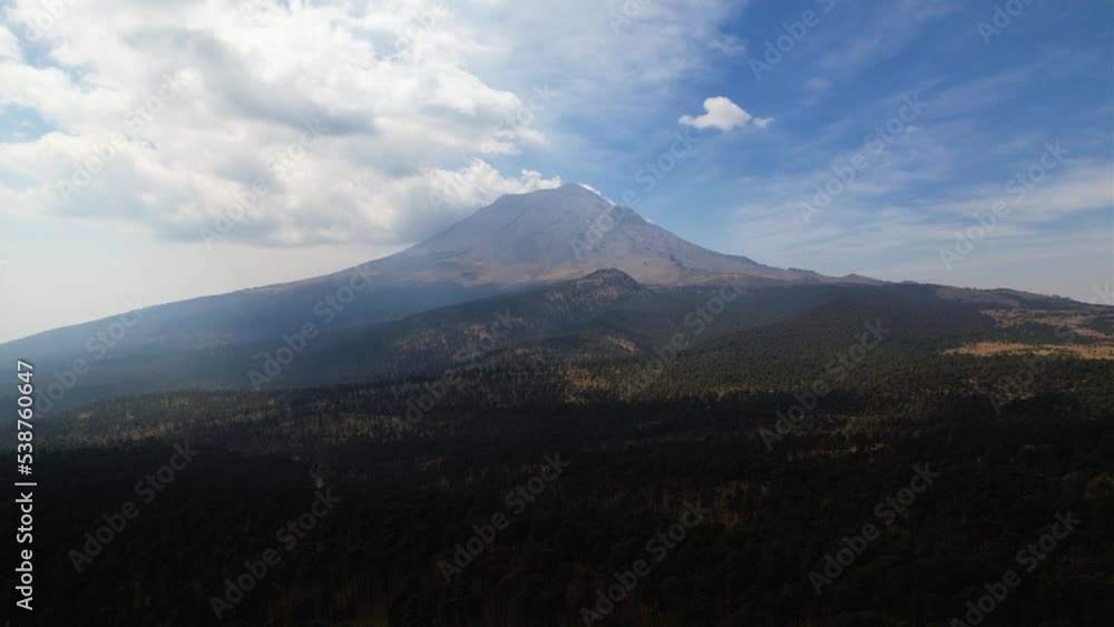 Aerial view towards the Popocatepetl Volcano in Mexico - approaching, drone shot Aerial view towards the Popocatepetl Volcano in Mexico - approaching, drone shot