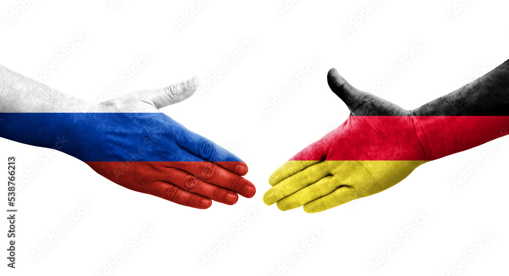 Handshake between Germany and Russia flags painted on hands, isolated transparent image.