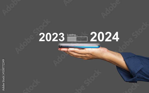 Countdown to 2024. The virtual download bar with loading progress bar for New Year's Eve and changing the year 2023 to 2024