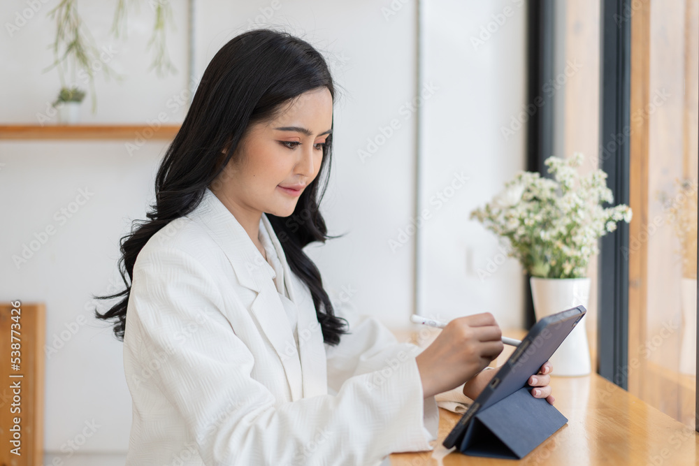 Happy asian young female client surf web read news or chat on tablet device, technology concept. Happy asian young female client surf web read news or chat on tablet device, technology concept.