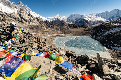 Kongma La, Nepal: Dramatic view of prayer flags at the summit of the Kongma La pass between Chukung and Lobuche on the way to Everest base camp in the Himalaya photo