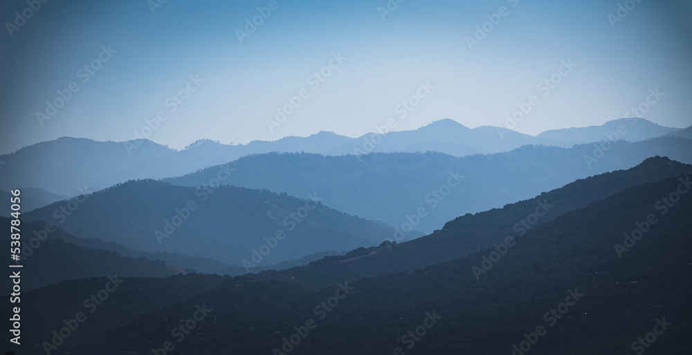 Blue mountain ridges in the morning haze