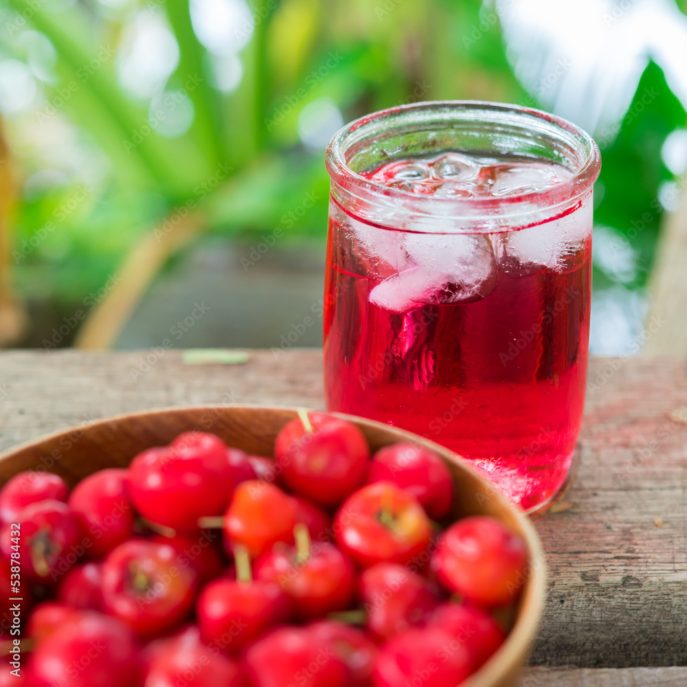 Glass of sour cherry juice with fresh red cherries, Cherry juice, on wood background, red drink, High vitamin C and antioxidant fruits. Glass of sour cherry juice with fresh red cherries, Cherry juice, on wood background, red drink, High vitamin C and antioxidant fruits.
