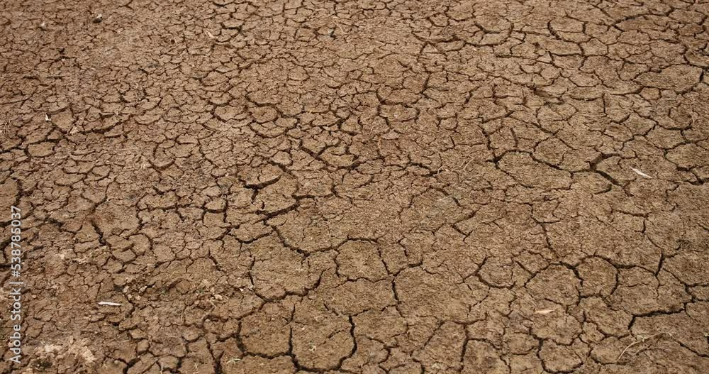 Cracked dry land in middle of desert, motion view Cracked dry land in middle of desert, motion view