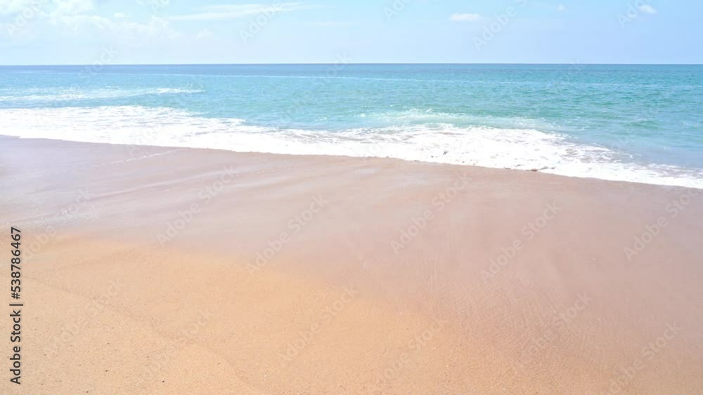 Slow-motion of waves sweeping across a sunny beach. Slow-motion of waves sweeping across a sunny beach.