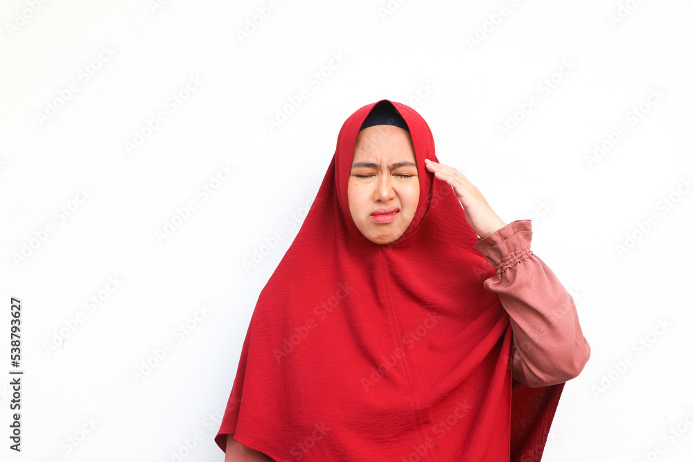Beautiful young Asian woman looking dizzy and having headache on white background Beautiful young Asian woman looking dizzy and having headache on white background