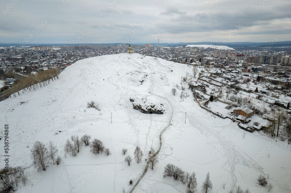 Flight over Lisya mountain or Fox mountain in the city of Nizhny Tagil, Russia. Aerial view