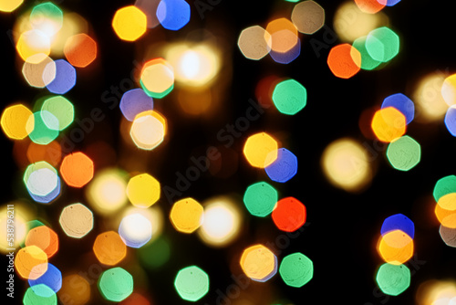 multicolored festive lights on a black background screensaver backdrop © сергей тарануха