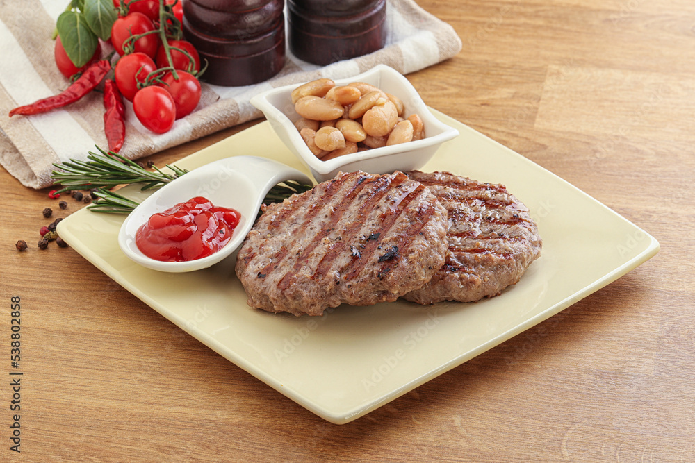 Grilled beef burger cutlet with sauce Grilled beef burger cutlet with sauce