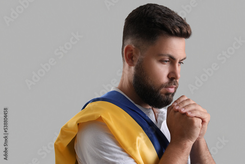 Young man with flag of Ukra...