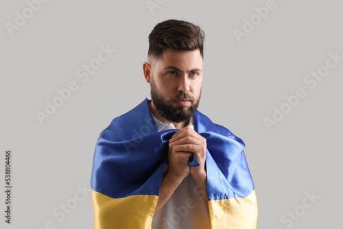 Young man with flag of Ukra...