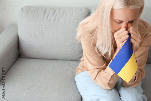 Mature woman with flag of U...