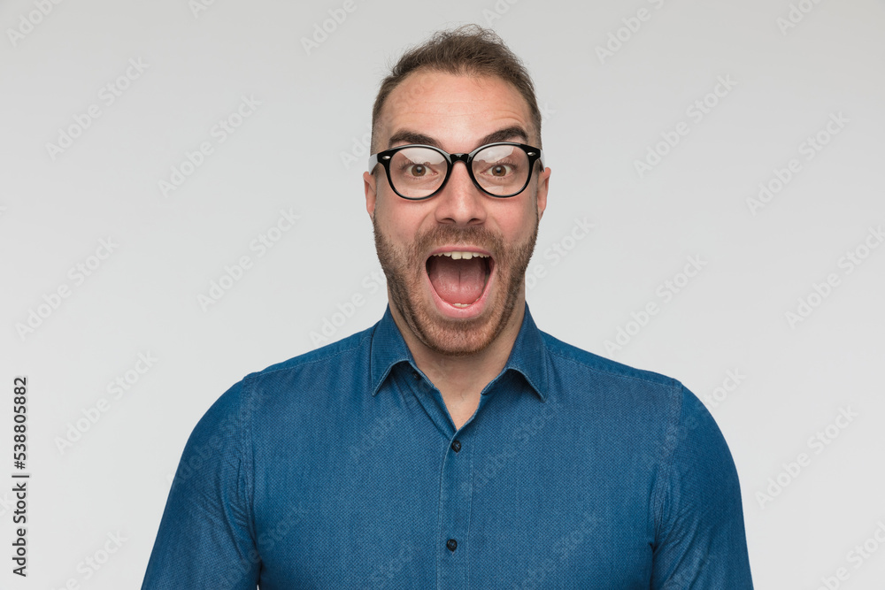 attractive casual man is giving a powerful shoutout attractive casual man is giving a powerful shoutout