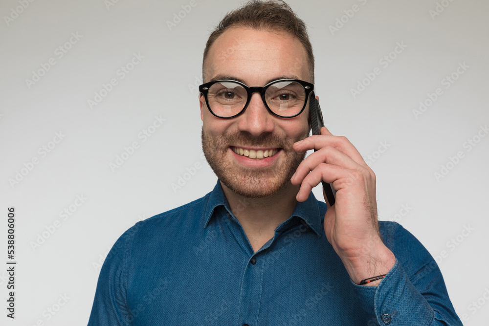 happy casual man is talking on the phone happy casual man is talking on the phone