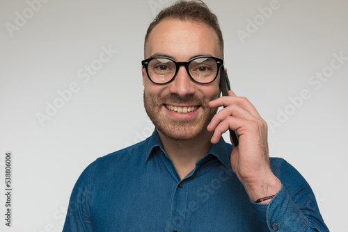 happy casual man is talking on the phone