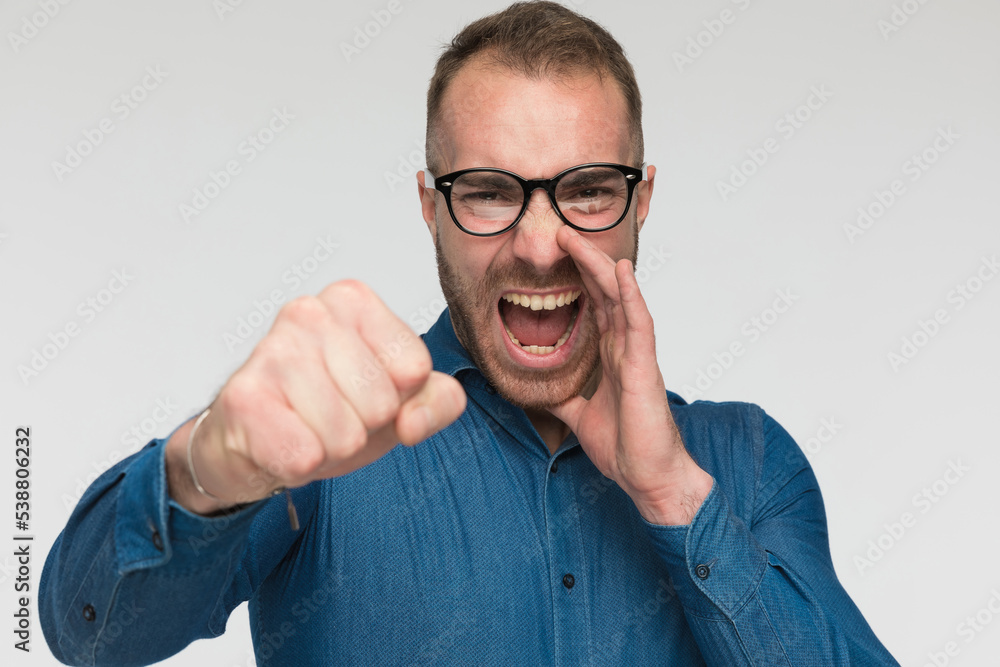 casual man is threating someone with a beating casual man is threating someone with a beating