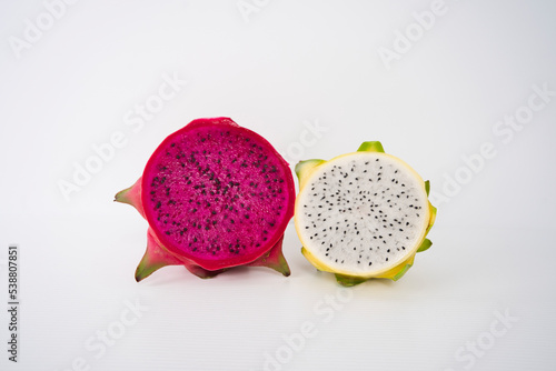 A couple of halved Pitaya or Dragon Fruits, isolated