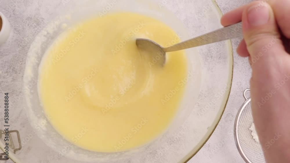 Mixing liquid yellow dough for baking Mixing liquid yellow dough for baking