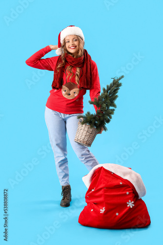 Smiling young woman in sant...