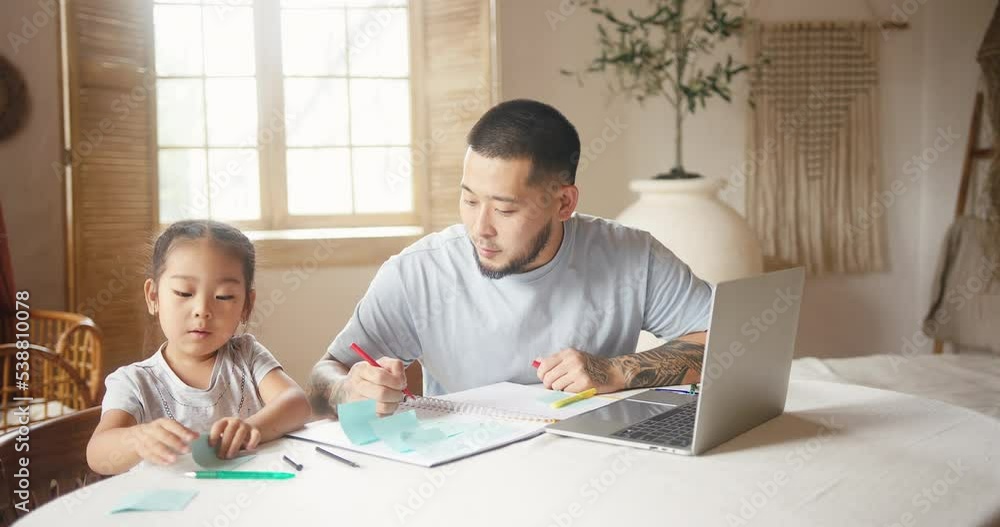 Asian father tries to attract daughter attention to screen Asian father tries to attract daughter attention to screen