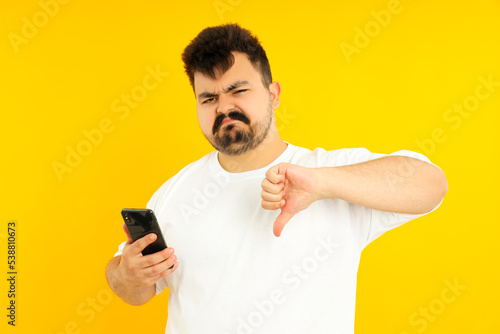 Concept of people, young fat man on yellow background