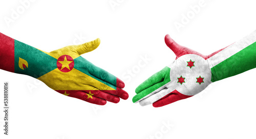 Handshake between Grenada and Burundi flags painted on hands  isolated transparent image.