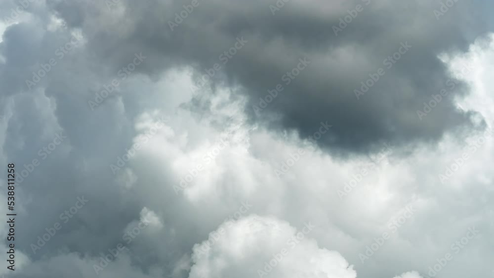 Cumulus clouds move against a clear blue sky. A white fluffy cloud is flying rapidly through the air. Meteorological observations of atmospheric phenomena. Cumulus clouds move against a clear blue sky. A white fluffy cloud is flying rapidly through the air. Meteorological observations of atmospheric phenomena.
