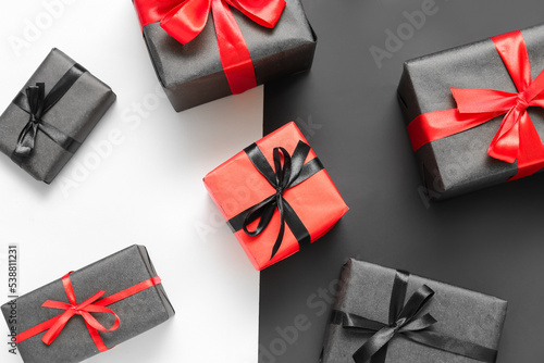 Gift boxes on color background. Black Friday sale