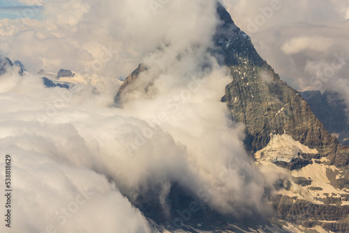 Beautiful alpine scenery in the Swiss Alps in winter  with dramatic cloudscape