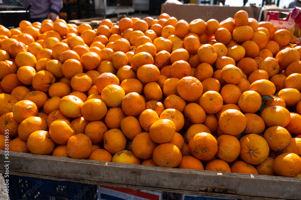 Tangerines in the market. The farmer sells citrus products.