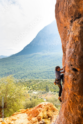 Rock climber climbing rock