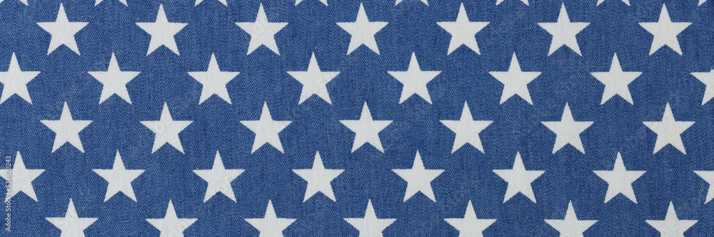 Blue fabric with white stars texture background closeup