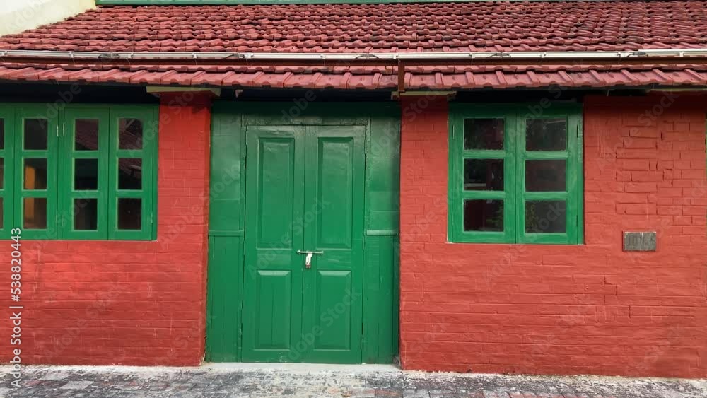 An old red building made during the British era inside of a jail premise in India An old red building made during the British era inside of a jail premise in India